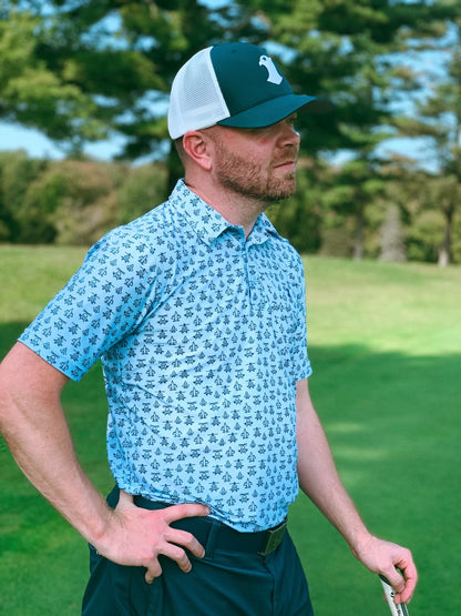 Light blue performance polo with helicopter and jet icon designs.