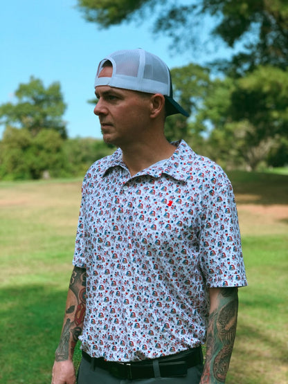 A white performance polo featuring patriotic red, white, and blue icon designs, perfect for celebrating the USA.